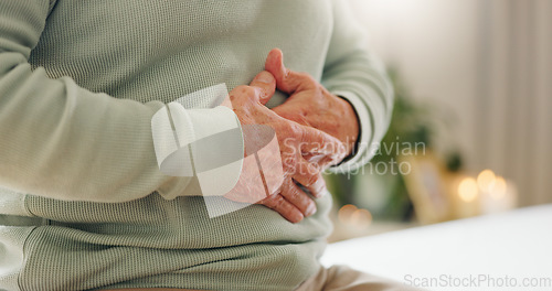 Image of Hands, stomach pain with closeup and gut health, person has digestion issue and nutrition with elderly care. Sick, colon and gas with healthcare and wellness, help and support for stress and illness