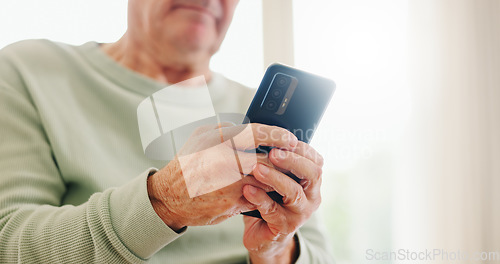 Image of Home, closeup and senior hands with a cellphone, typing and connection with social media, digital app and contact. Old man, pensioner or mature guy with a smartphone, mobile user and search internet