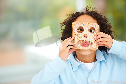Image of Child, funny or face food mask or bread play, nutrition hungry or eating health value. Boy, tongue or brown diet fibre for kid vitality cooking or meal prep dinner humor for snack, lunch or comedy
