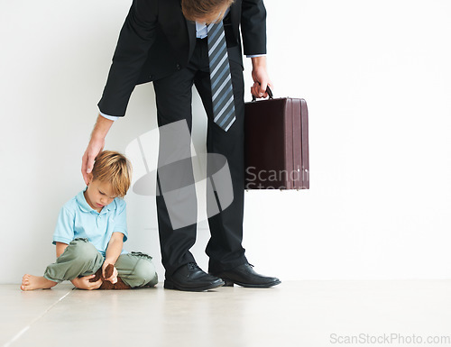 Image of Businessman, work and home by child for sad, autism and touch head for care or stop fear, support and anxiety. Father, kid and mental health on floor to help son, tired man and professional in stress