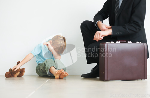 Image of Man, work and home by child with crying, autism and businessman late to care or stop fear, support or anxiety. Father, kid or mental health on floor to help son, tired and professional papa in stress