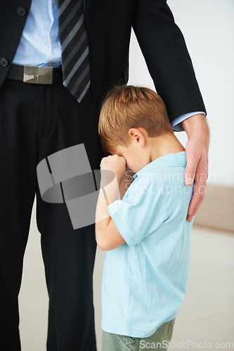 Image of Man, work and support for child with sad, crying and autism by businessman to stop fear, anxiety and care. Father, kid or mental health in house to help, tired or professional papa with hand of love