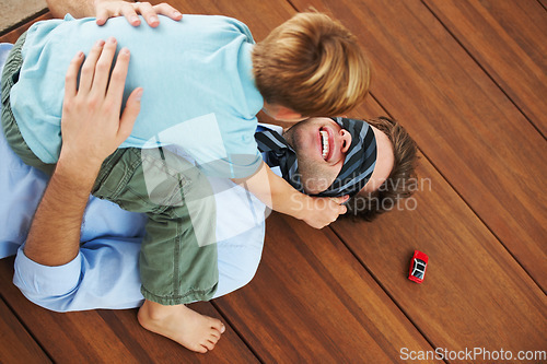 Image of Man, blindfold and playing with child in living room, happy and family home with support of businessman with kid. Man, boy and quality time together with trust in fantasy, game and care on floor