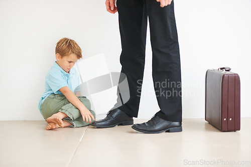 Image of Sad, child and businessman to leave for work, anxiety and tantrum, stop dad for care, support and love. Father, mental health or kid stress on floor for help, professional and headache or depression