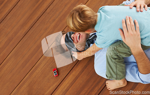 Image of Man, blindfold and playing games with child on living room, floor and happy family with love. Businessman, boy and quality time together with trust in house, toy and care to relax by support father