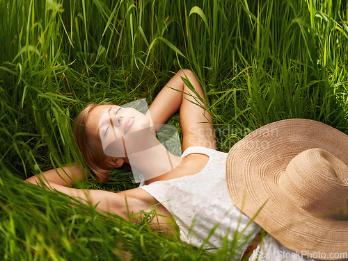 Image of Nature field, grass and relax woman sleeping, tired or nap for outdoor sunshine, morning wellness or rest. Forest garden, woods or eco person dream, spring comfort or park break on natural green lawn