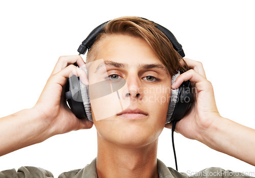 Image of Man, face and portrait with headphones listening to music in audio streaming against a studio background. Closeup of male person, DJ or model with headset for podcast, beats or sound track on mockup