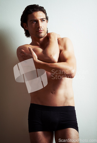 Image of Fitness, relax or man in underwear thinking of bodybuilding workout, training or exercise on white background. Topless model, bodybuilder or handsome person with healthy body or muscle for wellness