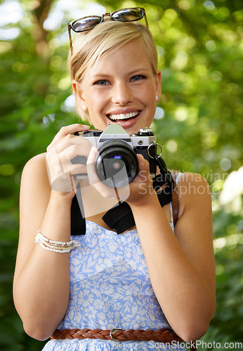 Image of Portrait, camera lens and photographer with woman in forest for smile, memory and photography. Summer, happy and adventure with person and shooting for vacation, holiday and environmental tourism