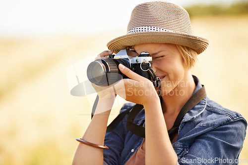 Image of Woman, camera and photography with travel, vacation and holiday with wheat field and plants. Nature, photographer and outdoor with traveler blog and countryside with photo for adventure and journey