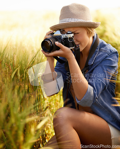 Image of Woman, camera and photography with summer, vacation and holiday with wheat field and travel. Nature, photographer and outdoor with traveler blog and countryside with photo for adventure and journey