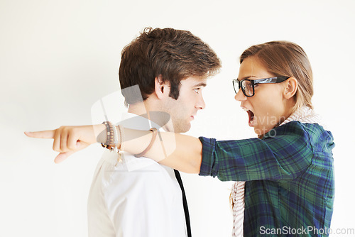 Image of Couple, screaming and fight, divorce and pointing in studio isolated on white background. Woman shout, breakup and man frustrated, angry at relationship fail or cheating, stress and marriage conflict