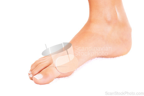 Image of Person with injury, foot and plaster, skin and wound closeup with health and medical aid on white background. Healthcare, bandage on blister and wellness with medicine, help and accident in studio