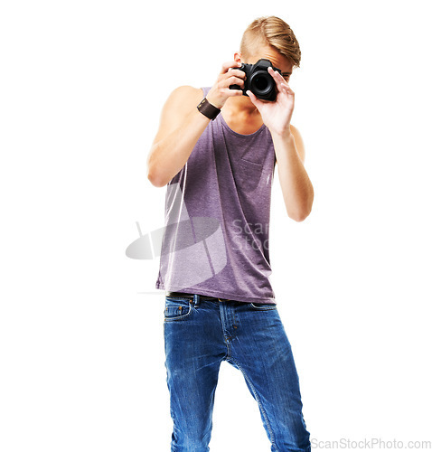 Image of Photographer, shooting and portrait with a camera in studio, space and white background. Digital, photography and man with confidence, pride and creative work with paparazzi, videography or model