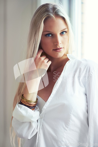 Image of Portrait, woman and thinking for idea with fashion in bedroom with hand on face. Norway, female person and blonde hair for looking with expression for vision in clothes, casual and style with jewelry