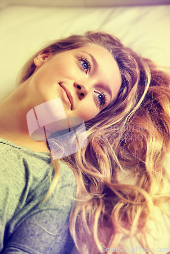 Image of Face, thinking and a woman in the bedroom of her home to relax on the weekend during a summer morning. Beauty, idea and inspiration with a young gen z person chilling alone in her apartment