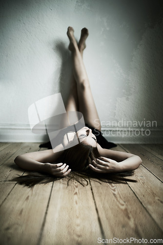 Image of Legs up on wall, relax and woman lying on a floor for peaceful, relax or moment in her home. Ground, chilling or female person laying down in a house for body relaxation, circulation or calm position