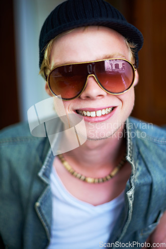 Image of Smile, cool and portrait of a man with sunglasses for fashion, streetwear and a teen trend. Happy, young and face or a person with trendy, stylish or fashionable eyewear, funky cap or shades