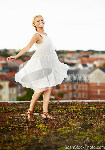 Image of Woman, happiness and spinning on holiday, summer and outdoor for vacation, smiling and city. Wind, dancer and urban area for break, getaway and carefree on trip, dancing and amsterdam spring time