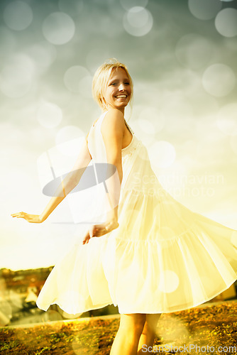 Image of Smile, bokeh and blonde woman in dress in the countryside, dance and freedom outdoor in summer. Happy, nature and person moving with energy on holiday, vacation or celebration for travel on field