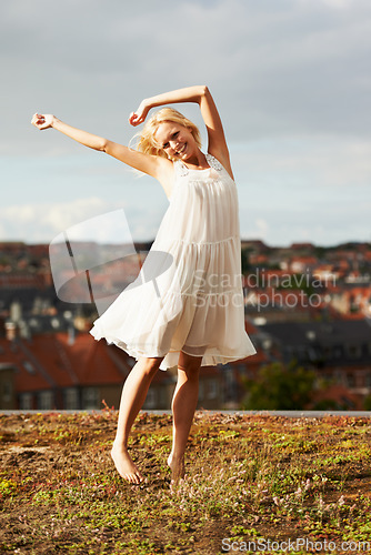 Image of Woman, freedom and dancing on vacation, happiness and outdoor for holiday, smiling and city. Summer, dancer and urban area for break, getaway and carefree on trip, barefoot and amsterdam spring time