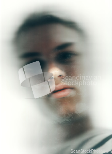 Image of Portrait, person and face with motion blur for mental health from bottom view in studio on white background. Male model, alone and mindset or anxiety for stress management, depression or suffering
