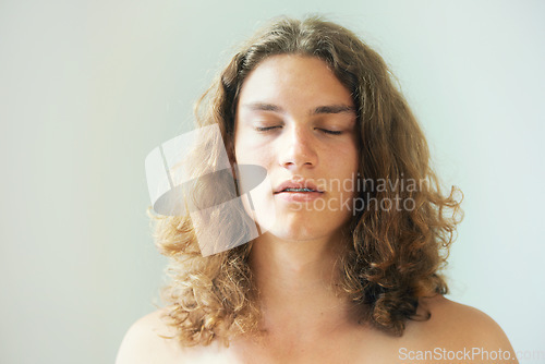 Image of Man, face and breathing in meditation with peace, zen and spiritual exercise to relax. Calm, person and thinking in holistic, yoga and healthy practice for mental health and white background