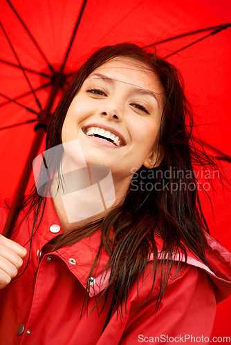 Image of Woman, smile and happy with umbrella in closeup, positive and ready for weather, storm and cold. Insurance, red raincoat and portrait or face, prepare and fashion or color, zoom and casual style