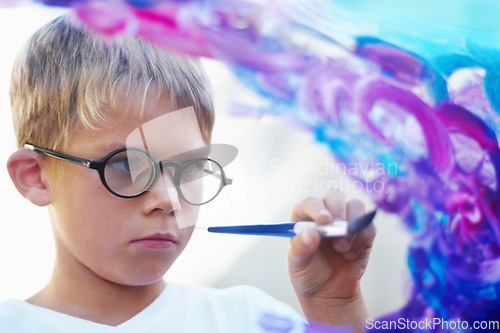 Image of Boy painting on glass, brush and creating artwork with glasses, education and learning. Person, child and kid with art, student and teaching with development, childhood and creativity with an artist