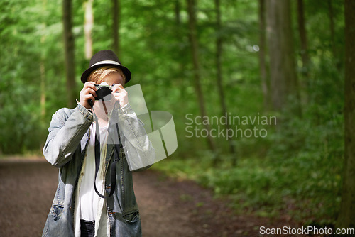 Image of Photographer, nature and man with a camera, adventure and tourism with a view, journey and freedom. Person, photography and guy with mountains, traveller and retro with landscape, creative and trees