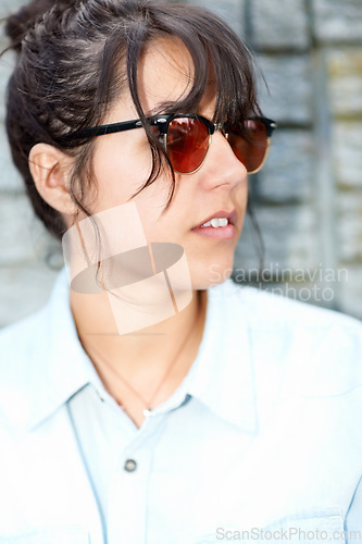 Image of Sunglasses, thinking and gen z girl in city for travel, confidence and chilling vibes on outdoor trip. Shades, face and female student relax on weekend while traveling in New York for holiday freedom