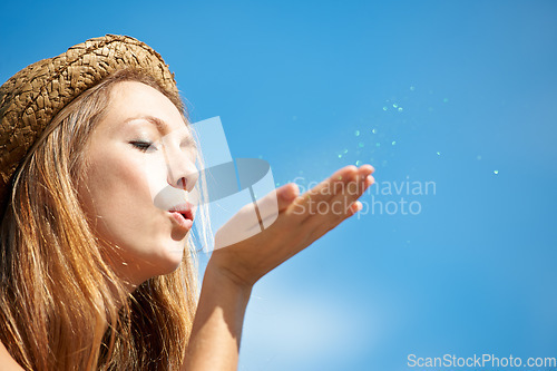 Image of Mockup, blue sky and a woman blowing glitter for celebration, event or a party in the city. Shimmer, closeup and a young girl with confetti or sparkle for a trend, wish or hope from a funky hipster