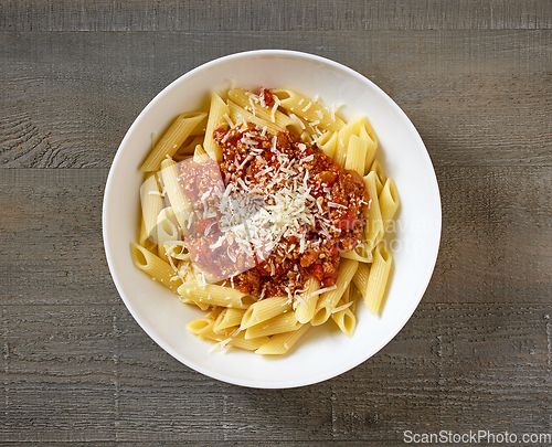 Image of bowl of pasta penne with sauce bolognese