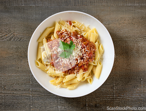 Image of bowl of pasta penne with sauce bolognese