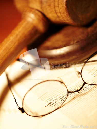 Image of Law table, report and glasses for justice, notes or work in the courtroom. Paperwork, knowledge and eyewear on an attorney desk for order, legal job or advocate trial for a judgment or crime defense