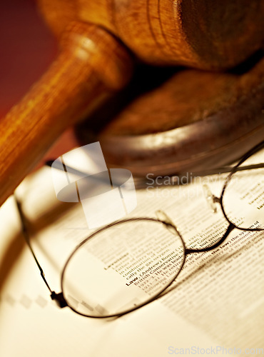 Image of Law table, document and glasses for jury, notes or work in the courtroom. Paperwork, knowledge and eyewear on an attorney desk for order, legal job or advocate trial for a judgment or crime defense