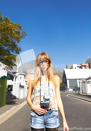 Image of Travel, photography and portrait of woman with camera for creative and art career in the city. Glasses, gen z and young female person from Australia with dslr equipment on weekend trip in town.