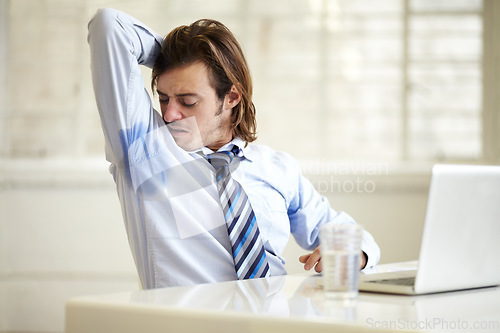 Image of Businessman, armpit and sweat smell at work for company employee stress, stink hygiene or bad stain. Male person, laptop and arm up for cleanliness mistake fail or frustrated, or wet shirt in office