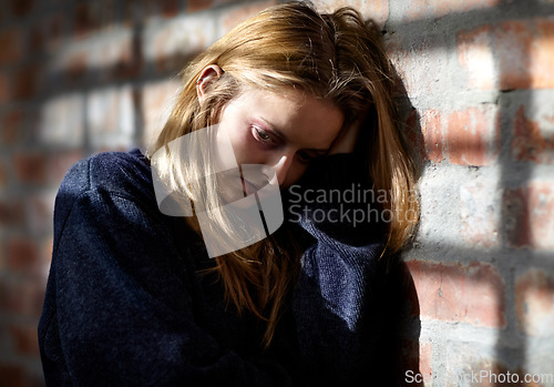 Image of Woman, abuse and scared with pain, hiding or fear with hands, afraid or conflict. Toxic relationship, shame or home for physical assault, problem or domestic violence with terror, anxiety or pain