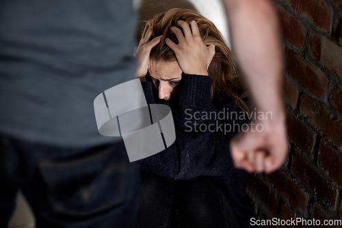 Image of Man, woman and abuse with fist, scared or hiding from partner, fear and angry with hands, conflict or terror. Toxic relationship, harassment or home for physical assault, problem or domestic violence