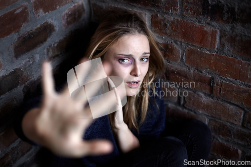 Image of Portrait, abuse and woman with stop, scared and fear in a corner, warning and domestic violence with terror. Face, person or girl with gesture, gender equality or victim with anxiety, stress or crime
