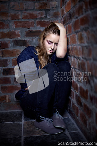 Image of Abuse, scared and woman on the floor, fear and domestic violence with addiction, crisis and depression. Person, girl and victim on the ground, anxiety and stress with horror, conflict and burnout