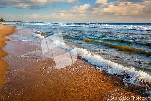 Image of Wave surging on sand