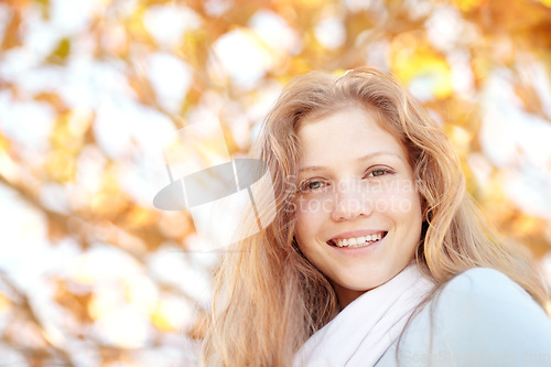 Image of Woman, autumn and nature at park with portrait and happy from travel, vacation and colorful leaves. Holiday, outdoor and female person smile in New York with freedom and adventure by tree in garden