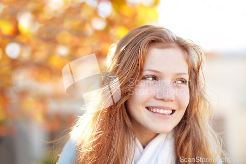 Image of Woman, autumn and nature at park with smile and happy from travel, vacation and colorful leaves. Holiday, outdoor and calm female person in New York with freedom and adventure by a tree in a garden