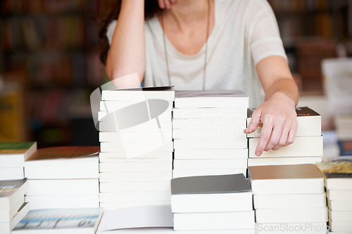 Image of Hands of person with books in library, bookstore or shop for research, learning and browse for purchase. Literature, knowledge and customer with book for education, information and reading for hobby