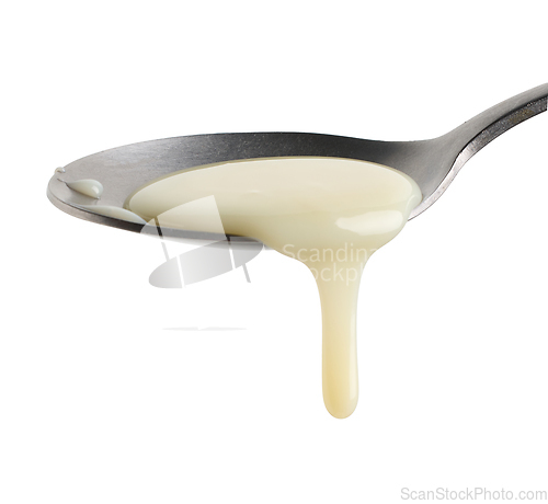 Image of condensed milk in a spoon