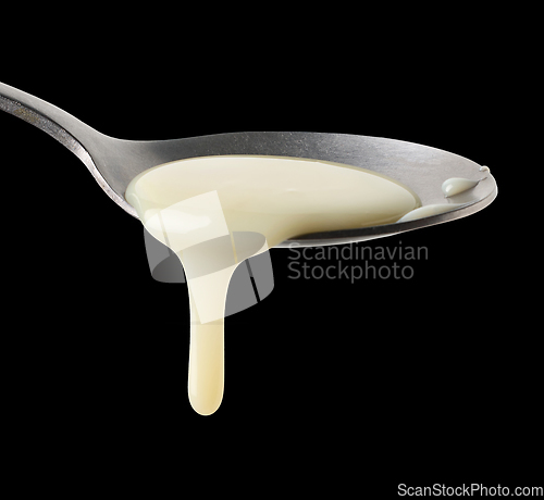 Image of condensed milk in a spoon