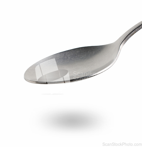 Image of empty spoon on white background