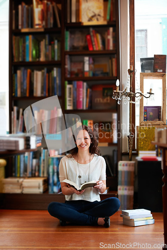 Image of Woman, reading and floor in bookstore, portrait or relax with development for knowledge, information and literature. Girl, books and ideas for learning, education or studying with research in shop